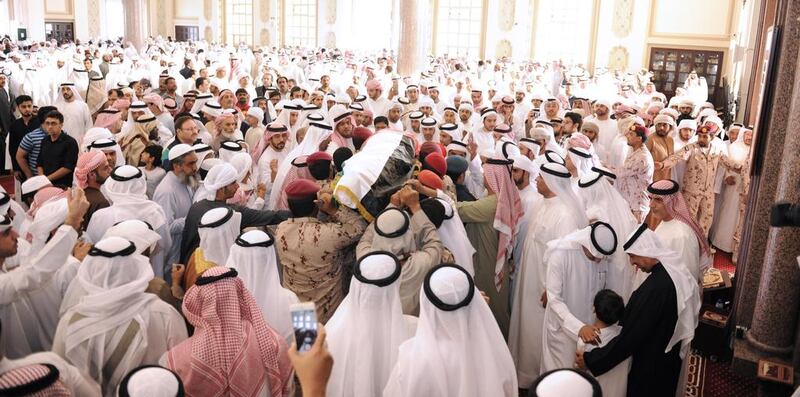 Men at Sheikh Shakhbout Mosque carry the body of Abdulhamid Sultan Al Hammadi, at the funeral prayers of Al Hammadi and Mohammed Ali Al Bastaki, who's body has yet to be recovered from the scene of the terror attack. Wam