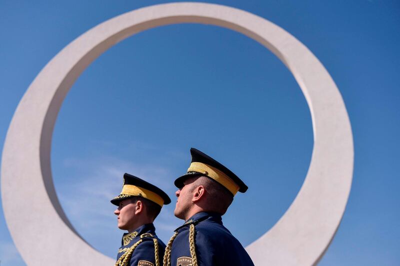 Members of the Kosovo Security Force (KSF) stand guard as they take part on in the inauguration of a memorial complex in the village of Marina, dedicated to the 157 Kosovo Liberation Army. AFP