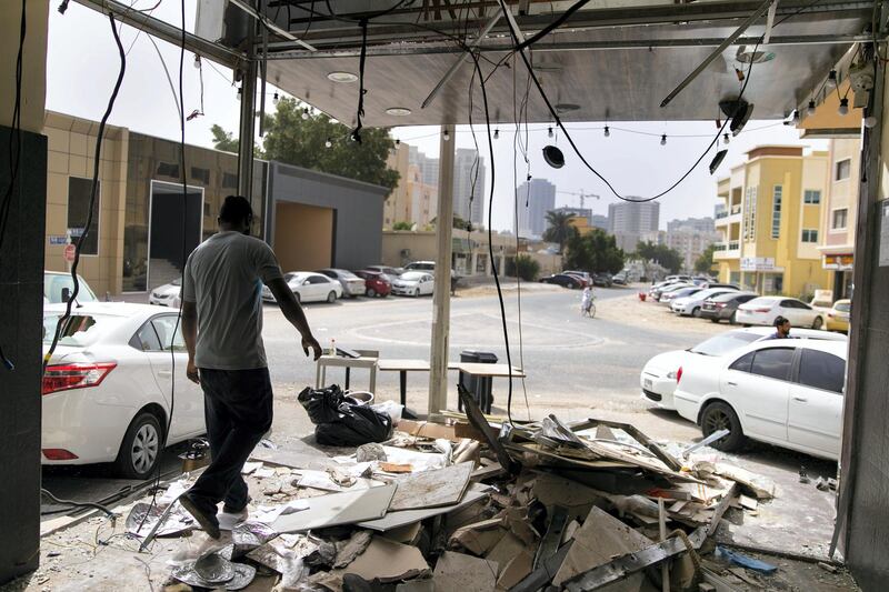 AJMAN, UNITED ARAB EMIRATES - JANUARY 22, 2019.

Men clear out items from  Feza Cafe, after a gas cylinder exploded on Tuesday in Feza Cafe in Ajman.

Five workers were injured and taken to Sheikh Khalifa Hospital after suffering moderate to severe injuries in the blast on Tuesday.

The cooking gas cylinder explosion demolished much of the cafe in the Al Rashidiya district. Fire crews and the ambulance service raced to the scene at about noon.

Lt Col Mustafa Sultan Al Ali of Ajman Civil Defence sent a safety warning to business owners after the incident.

���They should not store the gas cylinder inside the kitchen. It must be kept in a separate, well-ventilated box away from the kitchen and heat sources and should not be thrown or rolled down on the floor," he said.

"They also should make sure that the cylinder is sealed after use."


(Photo by Reem Mohammed/The National)

Reporter: SALAM AL AMIR
Section:  NA