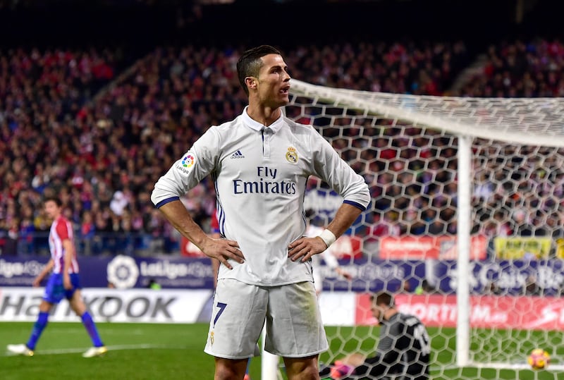 Real Madrid's forward Cristiano Ronaldo celebrates after scoring his third goal against Atletico Madrid on November 19, 2016. It was his 40th club hat-trick. AFP