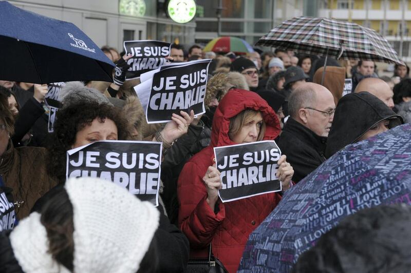 Protesters express their solidarity with the satirical magazine Charlie Hebdo. Photo: Eric Piermont / AFP