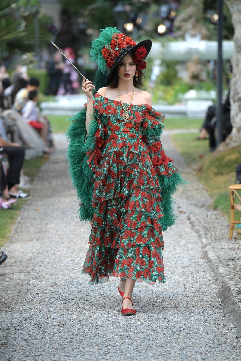 <p>Vibrant floral prints, a Dolce &amp; Gabbana trademark, were paired with an oversized hat laden with roses.&nbsp;Courtesy Dolce &amp; Gabbana</p>
