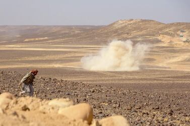 Smoke billows during clashes between forces loyal to Yemen's government and Houthi rebel fighters in Al Jadaan area about 50 kilometres north-west of Marib city in central Yemen on February 11, 2021. AFP