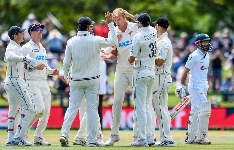 New Zealand bowler Kyle Jamieson, centre, is congratulated by teammates after dismissing Pakistan's Mohammad Rizwan. AP