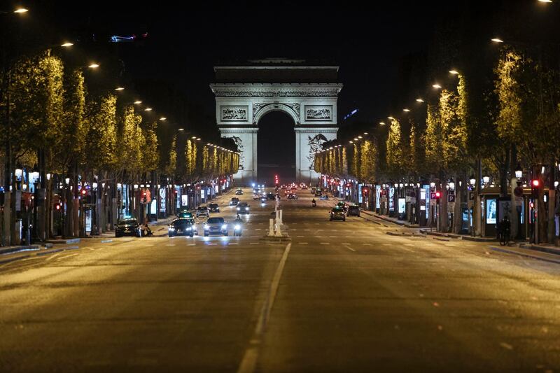 Champs-Elysees avenue is almost empty during lockdown in Paris. French restaurants, cinemas and theatres are trying to figure out ways to survive a new curfew aimed at stemming the flow of record new coronavirus infections.  AP Photo