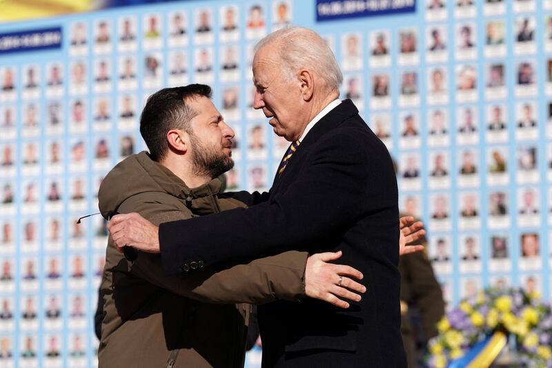 The two leaders share a warm embrace. AFP