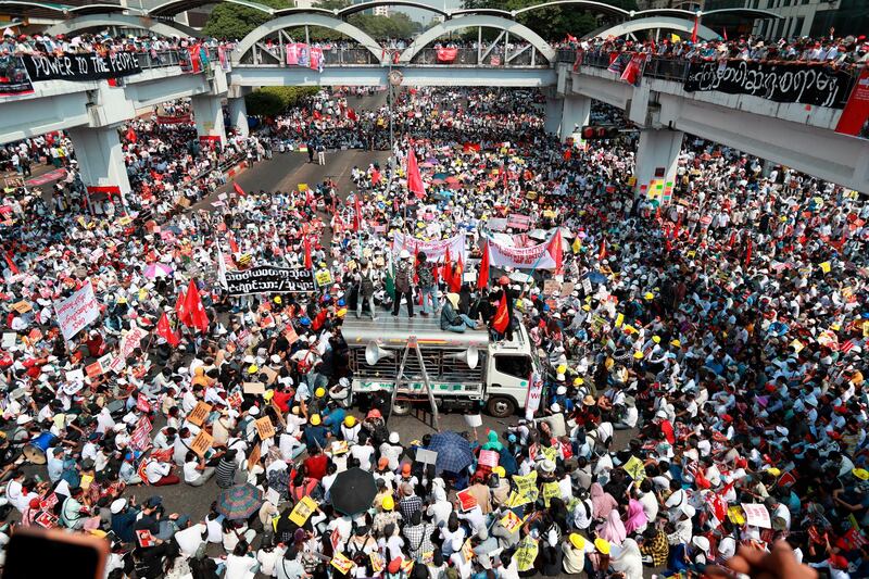 Anti-coup protesters gather at a junction in central Yangon, Myanmar. AP