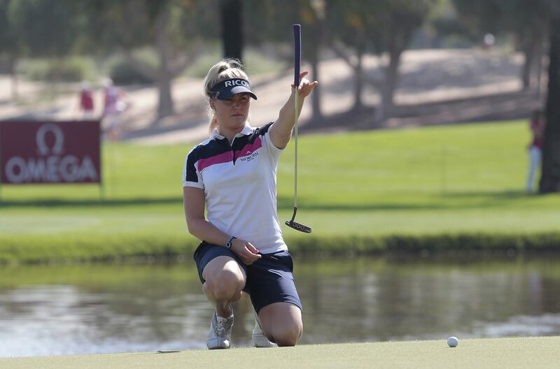 Charley Hull lines up her putt on the ninth hole on Day 1 of the Dubai Ladies Masters at Emirates Golf Club. Jeffrey E Biteng / The National 