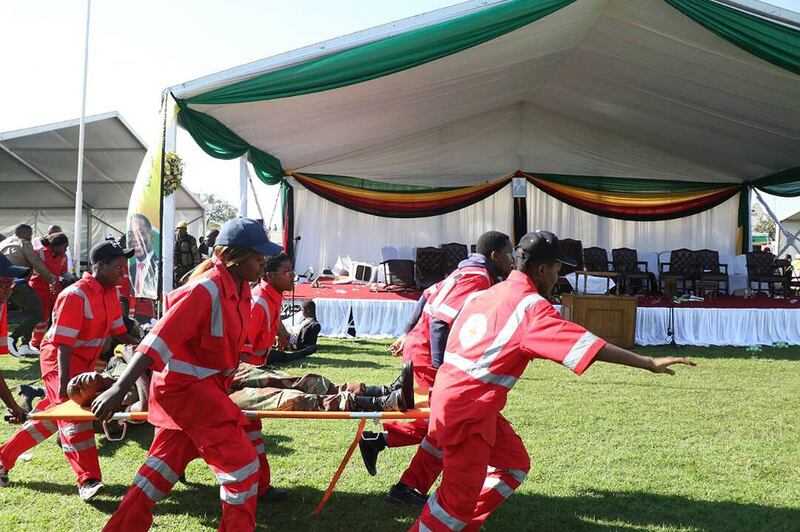 epa06834324 Members of the Zimbabwe Red Cross Society (ZRCS) carry an injured member of the Zimbabwe National Army (ZNA), who was reportedly injured after a suspected bomb went off at a rally addressed by President Emmerson Mnangagwa, at White City Stadium in Bulawayo, Zimbabwe, 23 June 2018. According to media reports, an apparent bomb attack rocked Zimbabwean President Emmerson Mnangagwa's election rally on 23 June in Bulawayo. The incident left multiple people injured, media added. 'The president was evacuated successfully,' his spokesman said.  EPA/STRINGER