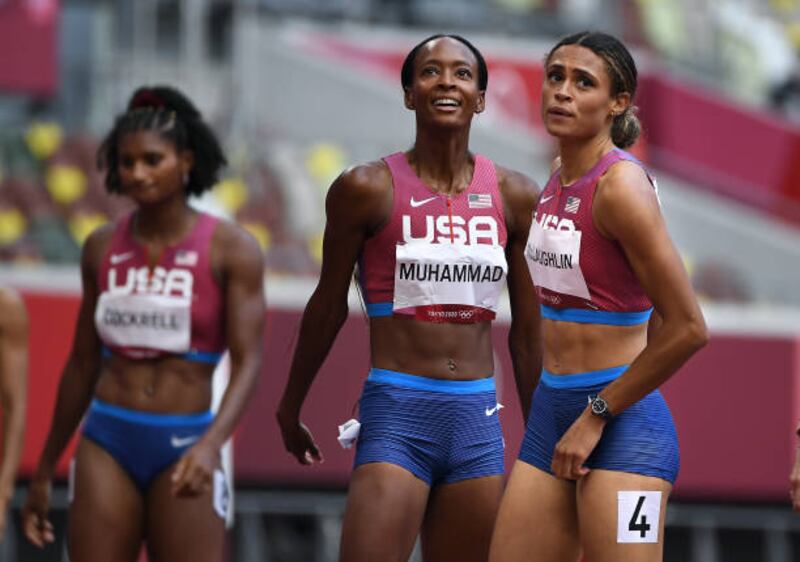 Sydney McLaughlin, right, celebrates her gold medal with silver medalist Dalilah Muhammed in the 400m hurdles at the 2020 Tokyo Olympics.