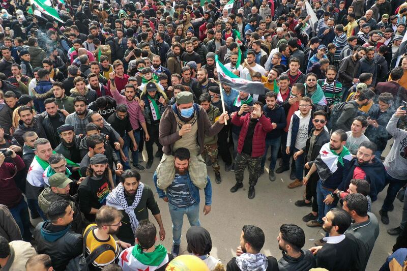 An aerial picture shows Syrians gathering in the rebel-held city of Idlib. AFP