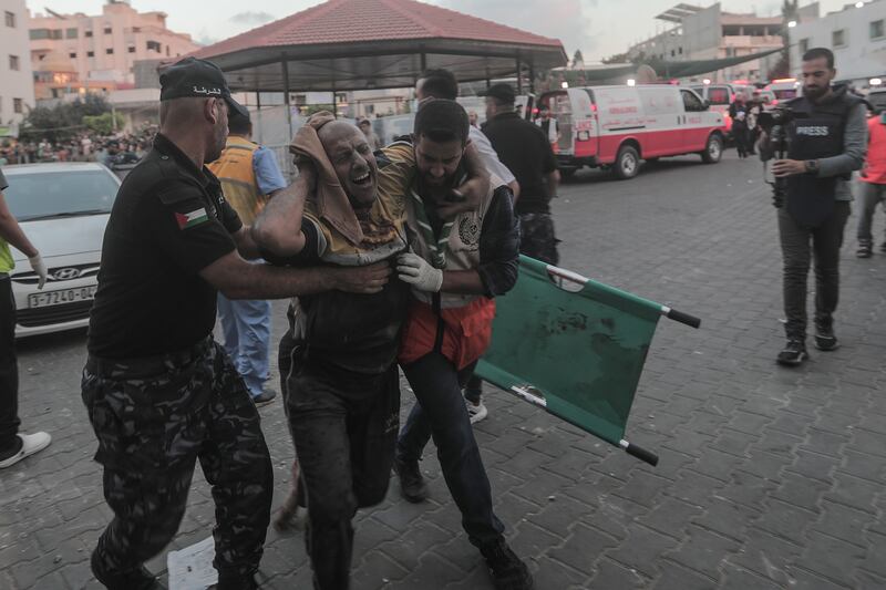 An injured Palestinian man arrives at Al-Shefa hospital in Gaza city. EPA