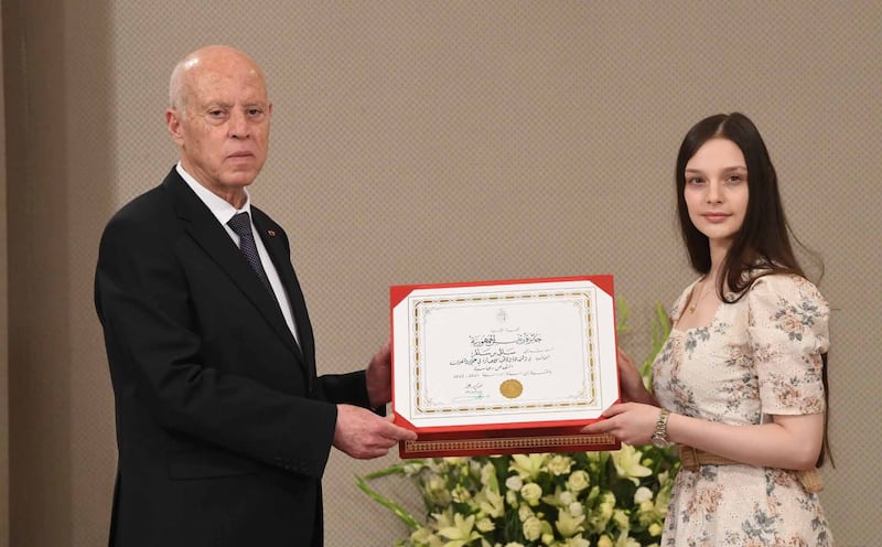 Sally Ben Salem, 22, receiving her award from Tunisian President Kais Saied at Carthage Palace. Photo: Tunisian Presidency