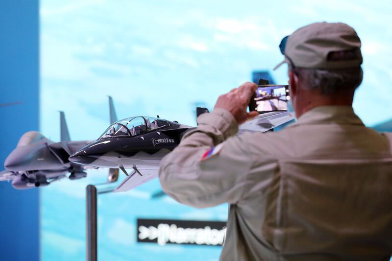 A visitor takes a picture of a Boeing T-7.