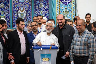 Hardline presidential candidate Saeed Jalili casts his ballot in Tehran. AP