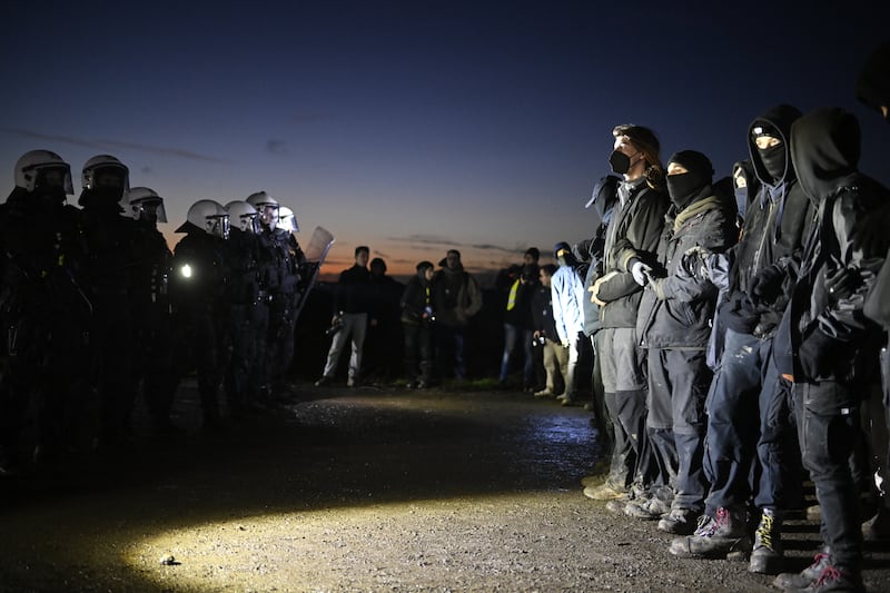 Activists clash with riot police. Getty