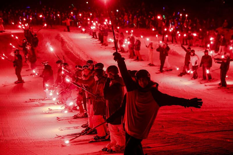 New Year's Eve is rung in with a torch-light ski down and fireworks during a holiday celebration in Vail, Colorado.  AP
