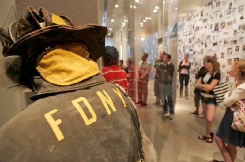 The helmet and jacket of Jonathan Ielpi are on display as at Tribute WTC as patrons view the other exhibits Wednesday, June 13, 2007 in New York.  Lee Ielpi and his son Jonathan were both firefighters. When Sept. 11 took the life of one, it became the life of the other. Lee Ielpi's message begins with his son's mission: Jonathan Ielpi was 29, a member of Squad 288, a husband and father of two. He was one of 343 members of the city's fire department killed when terrorists hijacked two jets and crashed them into the twin towers. As co-founder of the Tribute WTC Visitor Center, built in a converted deli next to ground zero on Liberty Street, Lee Ielpi's mission is to help visitors remember the more than 2,700 people killed in the attacks in New York.  (AP Photo/Frank Franklin II)