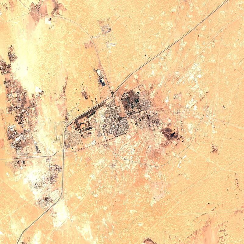 A false-color image from the European Commission's Sentinel-2 satellite shows Saudi Aramco's Abqaiq oil processing facility in Buqyaq, Saudi Arabia. Yemen's Houthi rebels claimed to have launched drone attacks on the world's largest oil processing facility in Saudi Arabia and a major oil field Saturday, sparking huge fires and halting about half of the supplies from the world's largest exporter of oil. Black char marks at the center of the facility suggest the attack struck at the heart of the processing facility. AP