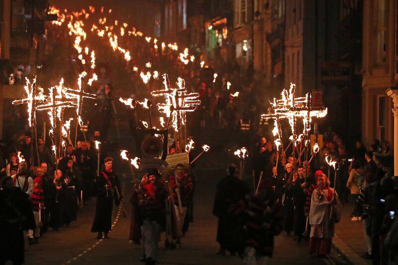 Revellers parade through the streets of Lewes in East Sussex, UK, during the traditional Bonfire Night celebrations. AFP