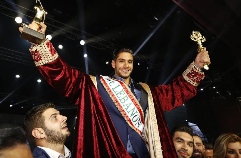 Paul Iskandar celebrates after winning the Mr Lebanon title during the beauty contest in Jounieh, north of the Lebanese capital Beirut. Anwar Amro / AFP
