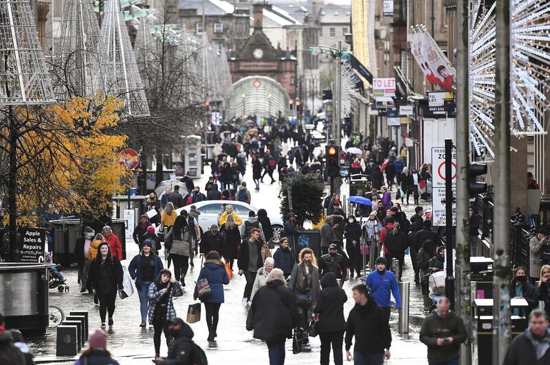 GLASGOW, SCOTLAND - NOVEMBER 18: Shoppers walk down Buchanan Street before level four restrictions come into place later in the week on November 18, 2020 in Glasgow, Scotland. More than two million people are to be placed under Scotland's toughest Coronavirus lockdown restrictions from Friday, with 11 council areas across western and central Scotland, including Glasgow being placed in level four. (Photo by Jeff J Mitchell/Getty Images)