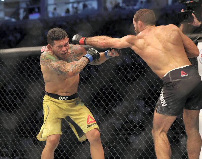 Abu Dhabi, United Arab Emirates - September 07, 2019: Lightweight bout between Mairbek Taisumov and Diego Ferreira (yellow shorts, winner) in the Main card at UFC 242. Saturday the 7th of September 2019. Yas Island, Abu Dhabi. Chris Whiteoak / The National