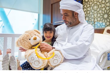 Ismail Mohammed holds his eleven-year-old Fatima Mohammed who was among the children who was given a free operation to fix the large gap in her lip and palate and her uneven jaw. Wam