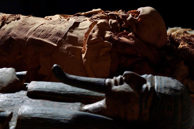 An ancient Egyptian mummy lies next to its coffin at the Civic Archaeological Museum in Bergamo, Italy. All photos: Reuters