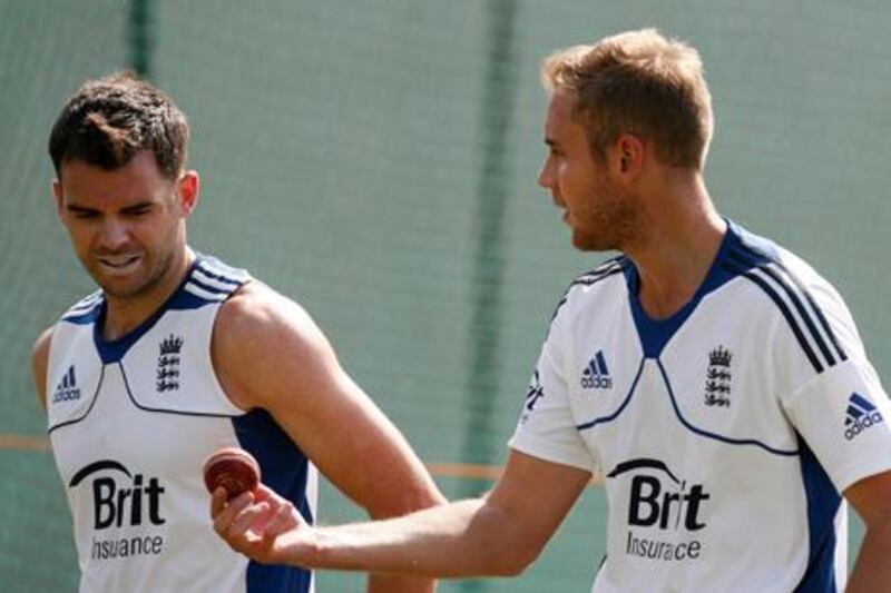 England's Stuart Broad shows the ball to teammate James Anderson.