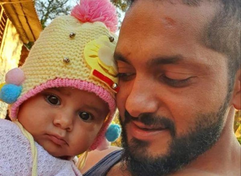 Yubraj Bhusal met his newborn daughter for the first time in November, eight months after his wife died shortly after childbirth. Courtesy: Yubraj Bhusal 