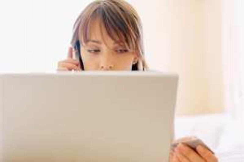 Woman shopping online --- Image by © Fancy/Veer/Corbis