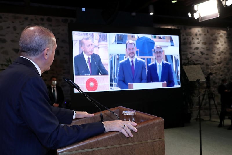 Mr Erdogan listens to Finance Minister Berat Albayrak and Energy Minister Fatih Donmez on a live video feed about the find. Reuters