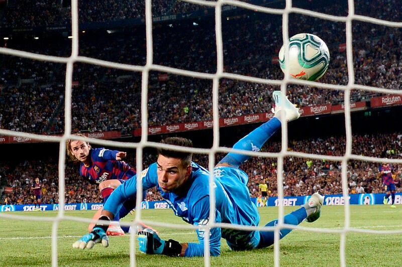 Barcelona's French forward Antoine Griezmann scores against Real Betis' Spanish goalkeeper Daniel Martin. AFP
