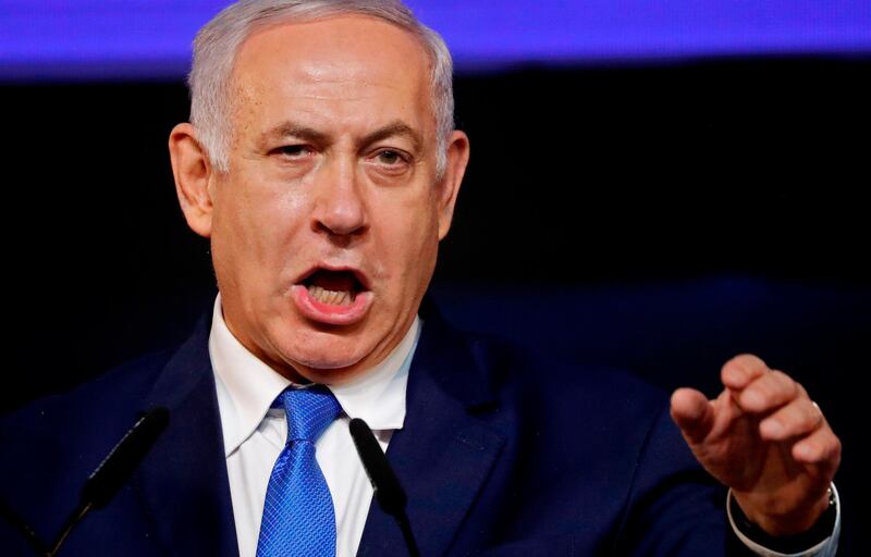 Israeli Prime Minister Benjamin Netanyahu gestures as he addresses supporters at his Likud Party headquarters in the Israeli coastal city of Tel Aviv on election night early on April 10, 2019. The results from yesterday's vote came despite corruption allegations against the 69-year-old premier and put him on track to become Israel's longest-serving prime minister later this year. / AFP / THOMAS COEX
