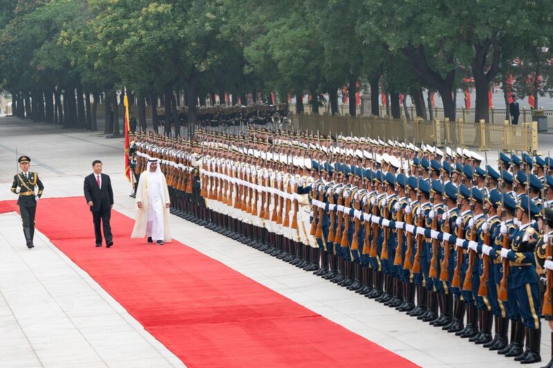 BEIJING, CHINA - July 22, 2019: HH Sheikh Mohamed bin Zayed Al Nahyan, Crown Prince of Abu Dhabi and Deputy Supreme Commander of the UAE Armed Forces (3rd L) and HE Xi Jinping, President of China (2nd L), inspect the Guard of Honour during a reception, at the Great Hall of the People.

( Rashed Al Mansoori / Ministry of Presidential Affairs )
---