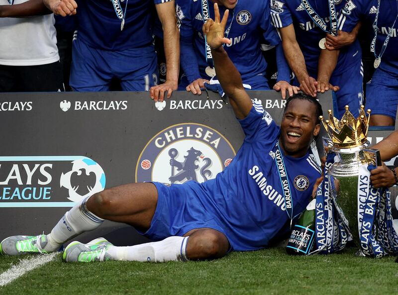 LONDON, ENGLAND - MAY 09:  Chelsea's hat trick hero  Didier Drogba celebrates with the trophy after winning the league with an 8-0 victory during the Barclays Premier League match between Chelsea and Wigan Athletic at Stamford Bridge on May 9, 2010 in London, England.  (Photo by Chelsea FC/Chelsea FC via Getty Images)