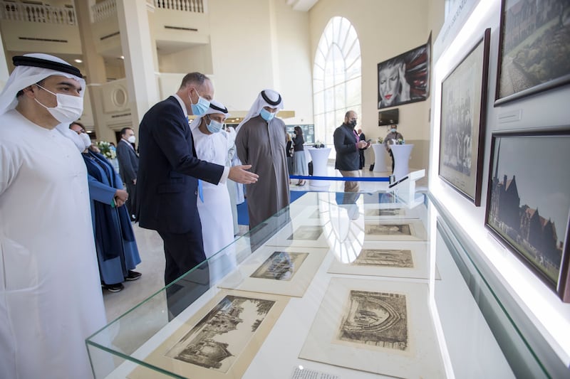 Dr Abdulla Al Karam, director general of the Knowledge and Human Development Authority, which regulates private schools in Dubai, looks at the exhibits. Mark Semmence, headmaster of Repton School in England, talks about its history. Ruel Pableo / The National