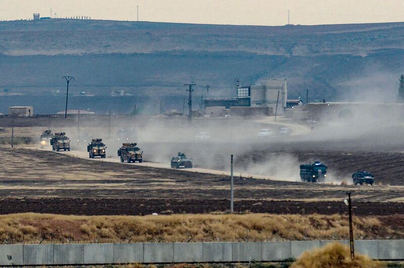 Turkish and Russian military vehicles return from a joint patrol in the countryside of Kiziltepe town in Syria's northeastern Mardin province on the Syrian-Turkish border. AFP