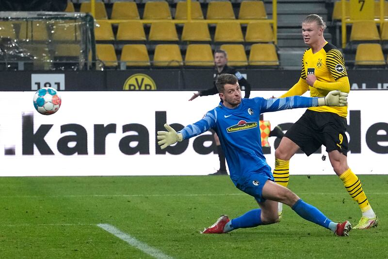 Dortmund's Erling Haaland scores against Freiburg during the  Bundesliga match in January, 2022. AP
