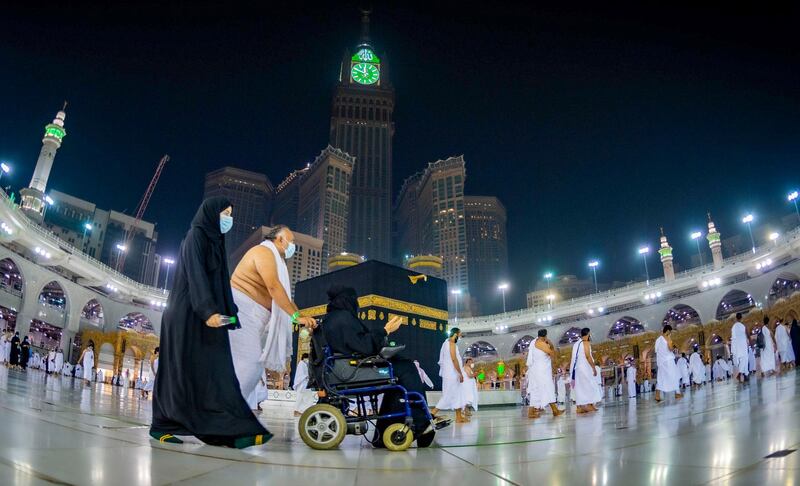Saudis and foreign residents circumambulate the Kaaba (Tawaf) in the Grand Mosque complex in the holy city of Makkah, as authorities partially resume the year-round Umrah for a limited number of pilgrims amid extensive health precautions after a seven-month coronavirus hiatus. Saudi Ministry of Hajj and Umra / AFP