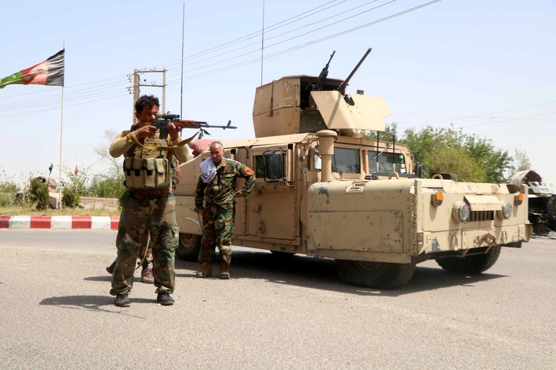 Afghan security officials stand guard at a checkpoint in Herat, Afghanistan. The Taliban are making gains in the country. EPA