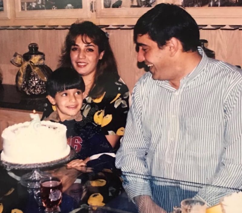 Sam Asghari as a child, with his parents. Instagram / Sam Asghari