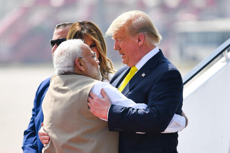 India's Prime Minister Narendra Modi embraces US President Donald Trump upon his arrival at Sardar Vallabhbhai Patel International Airport in Ahmedabad.  AFP