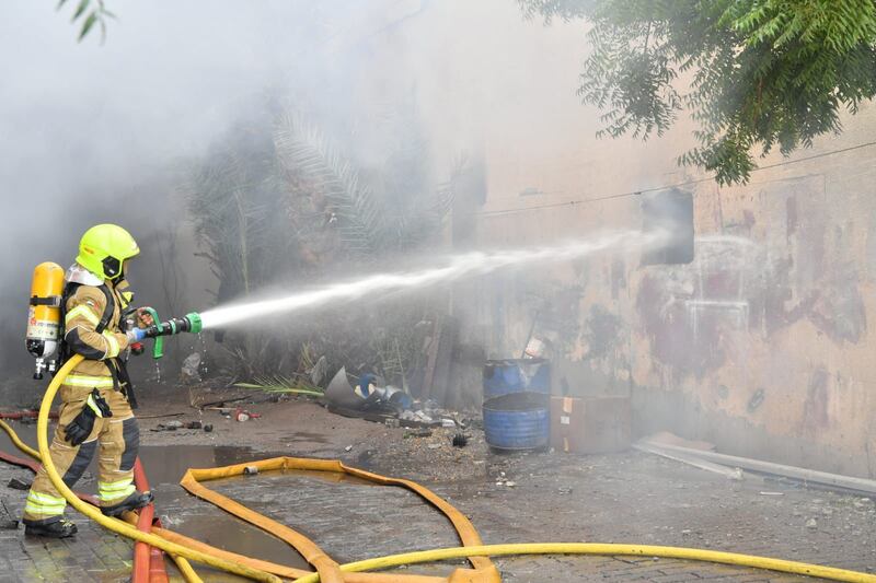 A paint warehouse and a second unit containing building materials were engulfed in flames.