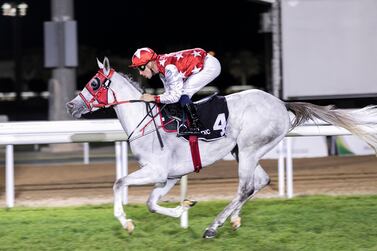 Fabrice Veron guides Dhafra to win the Abu Dhabi Fillies Classic on Sunday. Reem Mohammed / The National