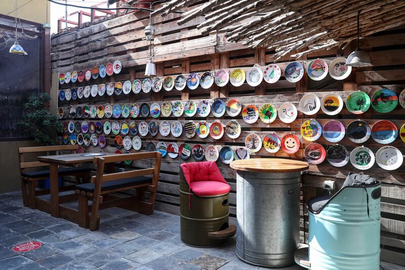 Creative decor in the outdoor seating area at Art House Cafe. Khushnum Bhandari / The National