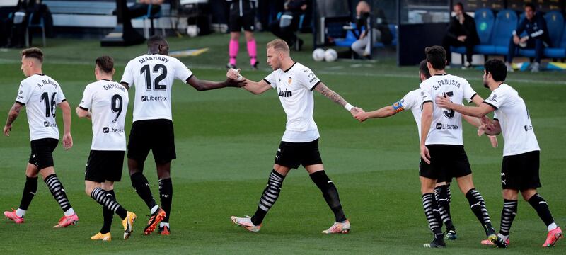 Valencia's Kevin Gameiro celebrates with his teammates after scoring the equaliser. EPA