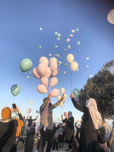 Many Muslims, Christians, Jews and Druze travelled up to Mount Precipice to release hundreds of balloons for peace after breaking bread together in Nazareth last week. Courtesy Rashmee Roshan Lall