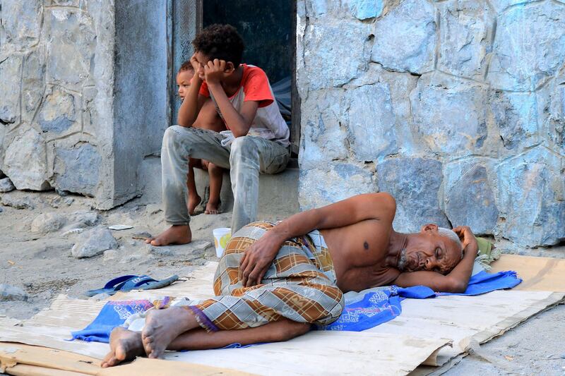 A man sleeps outside his home because of the intense heat in Yemen's Red Sea port city of Hodeidah. AFP